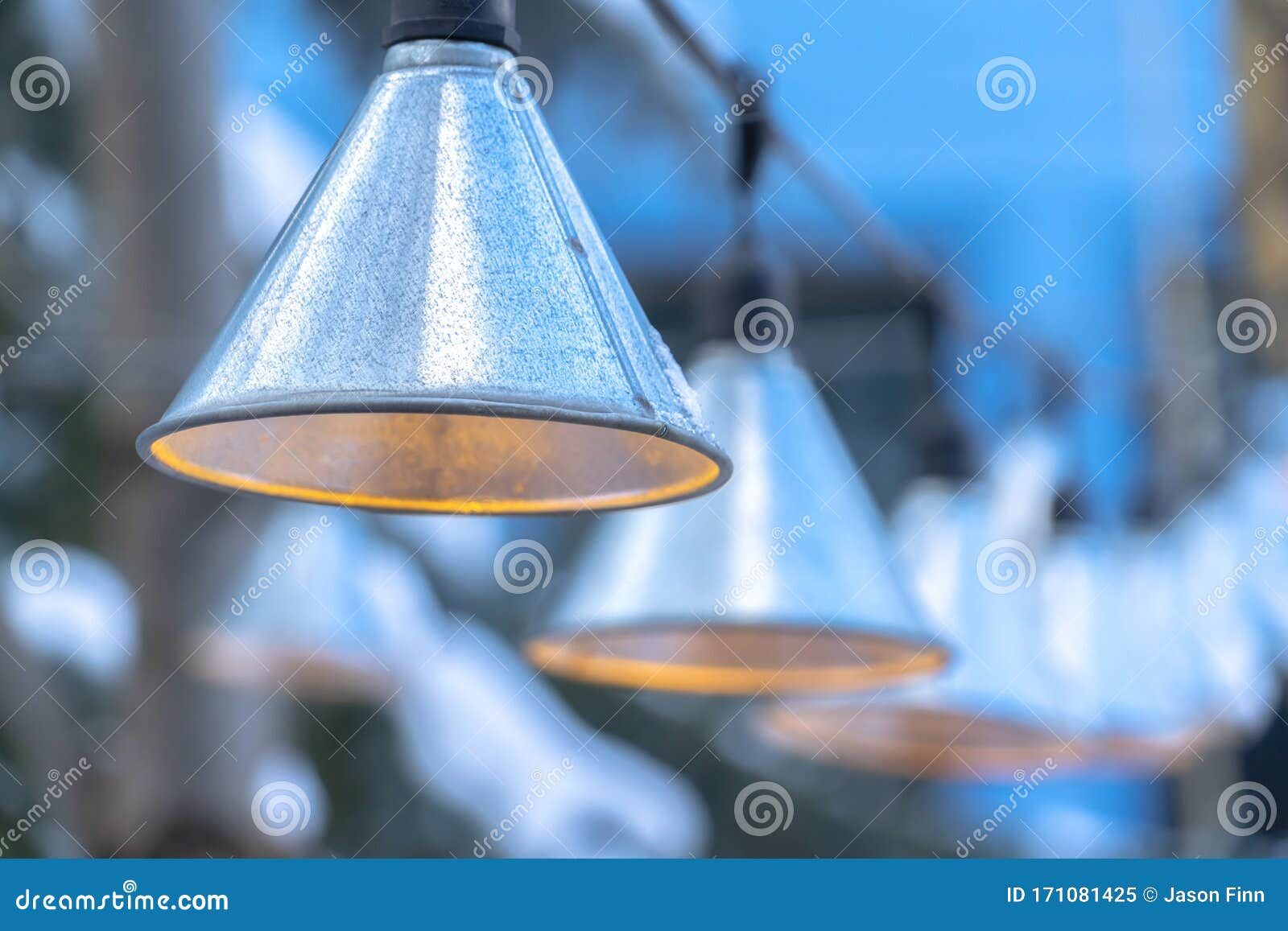 Decorative Cone Shaped Lamps Hanging On Black Strings Outside Home In ... throughout 6' Electric Black Metal Cone Patio Lights
