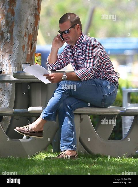 Chris O'Donnell Sitting On A Park Bench In Los Angeles Featuring: Chris ... throughout O'Donnell Bench Craftsmanship and Enduring Appeal