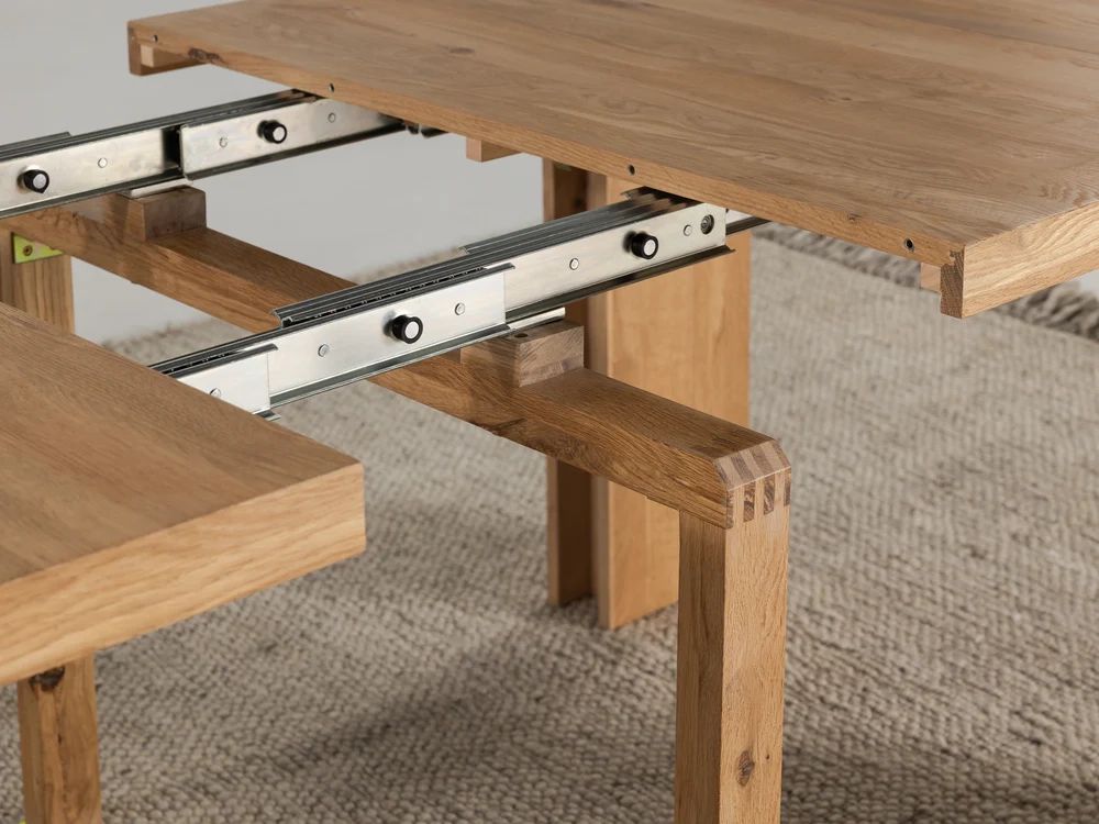 Understanding the mechanics behind slide mechanism dining tables