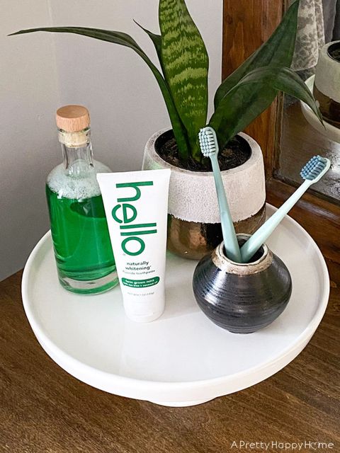 Use A Cake Stand To Corral Bathroom Counter Clutter – A Pretty Happy Home for Cake Stand Bathroom Organizers